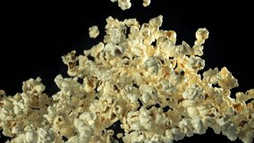 Popcorn flies up and falls down. On a black background. Filmed on a high-speed camera at 1000 fps. High quality FullHD footage - Powered by Shutterstock - Get 15% off with code: PIKWIZARD15