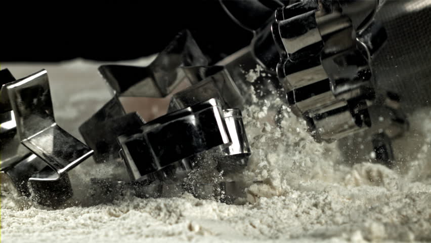 Cookie cutters fall into the flour. Filmed on a high-speed camera at 1000 fps. High quality FullHD footage