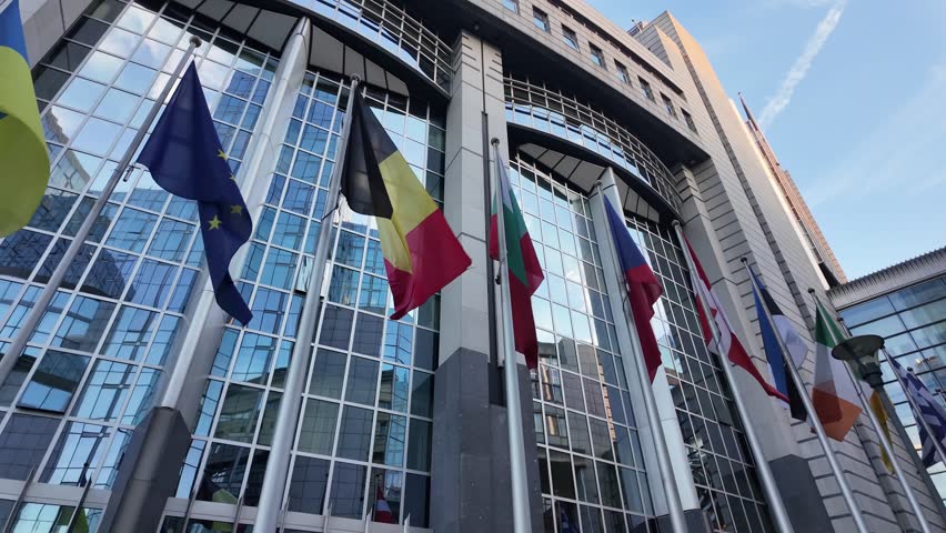 Belgian flag waving outside European Parliament in Brussels