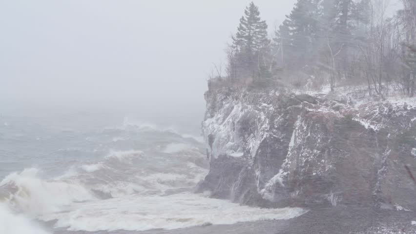Roaring Winds And Crashing Waves On Lake Superior Shoreline. Winter Storm At Tettegouche State Park In Silver Bay, Minnesota. wide shot