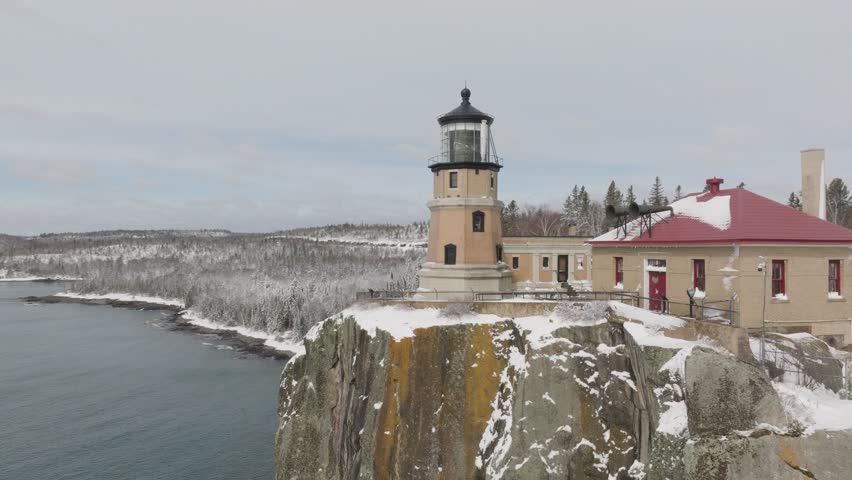 Split Rock Lighthouse During Winter In Minnesota, USA. - aerial shot