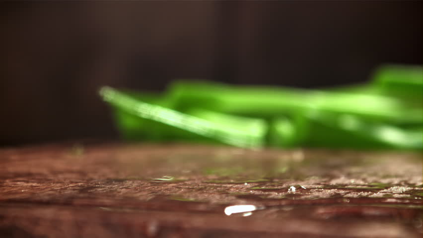 The chopped green onions fall onto the cutting board. Filmed on a high-speed camera at 1000 fps. High quality FullHD footage