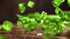 The chopped green onions fall onto the cutting board. Filmed on a high-speed camera at 1000 fps. High quality FullHD footage - Powered by Shutterstock - Get 15% off with code: PIKWIZARD15