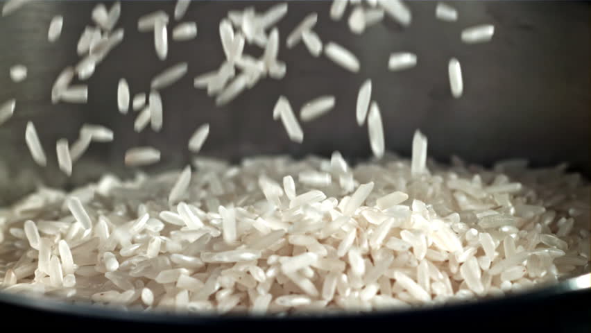 The grains of rice fall into the pot. Filmed on a high-speed camera at 1000 fps. High quality FullHD footage
