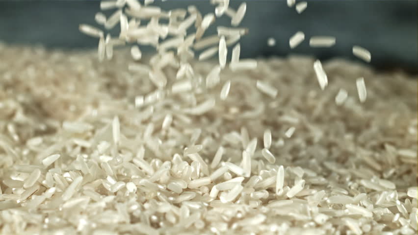 The grains of rice fall into the pot. Filmed on a high-speed camera at 1000 fps. High quality FullHD footage
