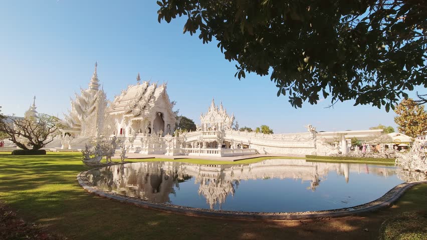 Chiang Rai, Thailand - 1st february ,2024: sunny Wat Rong Khun or White Temple - famous Buddhist temple in Pa O Don Chai, Mueang District, Chiang Rai Province, Thailand. Famous sightseeing landmark