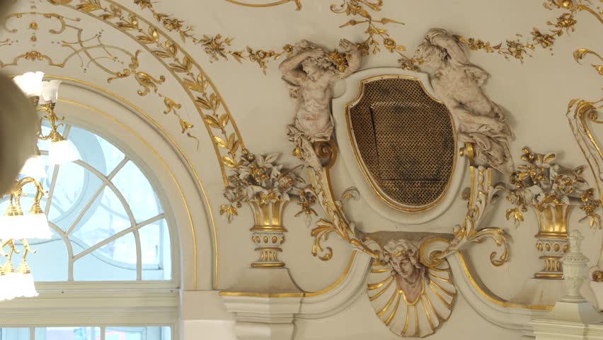 Delicate Stucco Figures and Golden Florals Adorn the Entrance of the Katona József Theater in Kecskemét, Hungary - Close Up