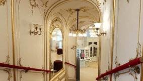 The Elegant Entrance Hall, Featuring Ornate Mirrors, Gilded Moldings, and Vintage Lighting, at the Katona József Theater in Kecskemét, Hungary - Dolly Shot - Powered by Shutterstock - Get 15% off with code: PIKWIZARD15