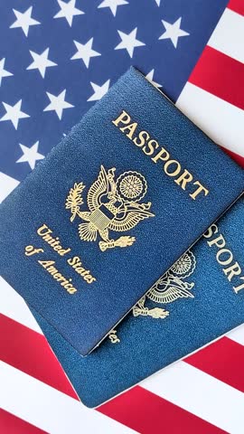 American passport against the background of the US national flag. Document for travelling and business