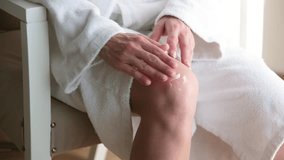 Joint problems and tendon inflammation. woman having knee pain, applying medical cream to her knee sitting in the room at home or hotel
 - Powered by Shutterstock - Get 15% off with code: PIKWIZARD15