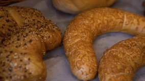 Freshly baked cheesy crescent bread and braided challah on bakery counter - Powered by Shutterstock - Get 15% off with code: PIKWIZARD15