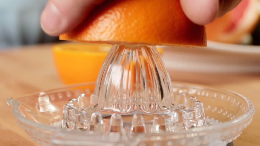 Squeezing fresh orange juice