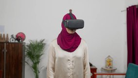 Happy Muslim Woman in Hijab Scarf Looking Around in VR World, Virtual Reality - Powered by Shutterstock - Get 15% off with code: PIKWIZARD15