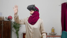 Muslim Woman in Hijab Scarf Experiencing VR for the first time, Virtual Reality - Powered by Shutterstock - Get 15% off with code: PIKWIZARD15