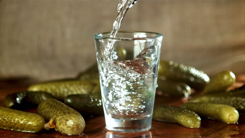 Vodka is poured into a glass. Filmed on a high-speed camera at 1000 fps. High quality FullHD footage