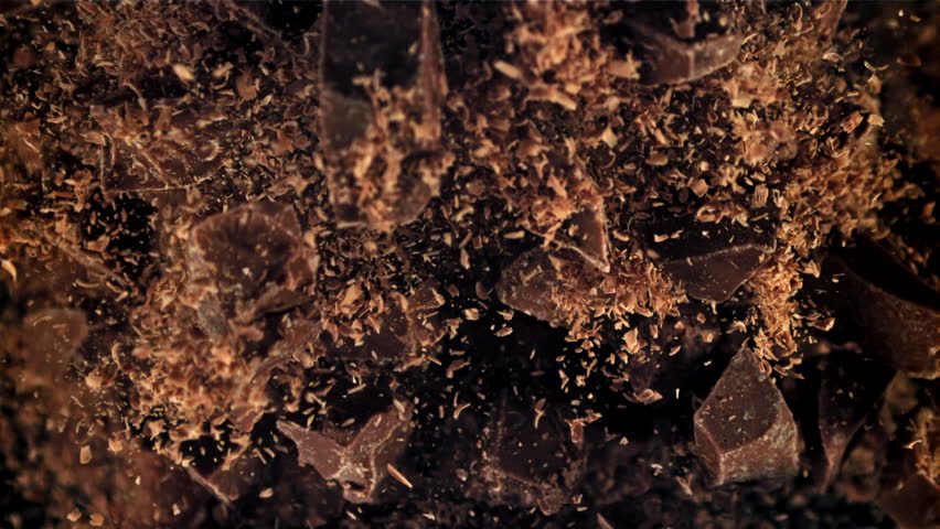 Chunks of chocolate fly up and fall down. Filmed on a high-speed camera at 1000 fps. High quality FullHD footage