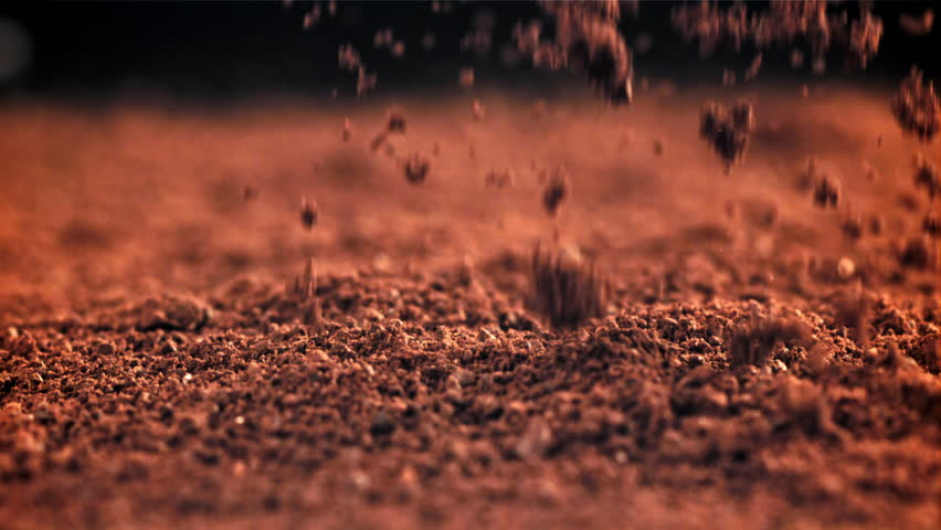 Ground coffee drop. Filmed on a high-speed camera at 1000 fps. High quality FullHD footage