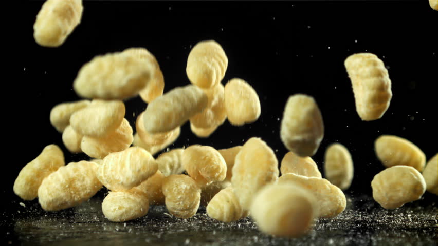 Gnocchi fall on the table. Filmed on a high-speed camera at 1000 fps. High quality FullHD footage