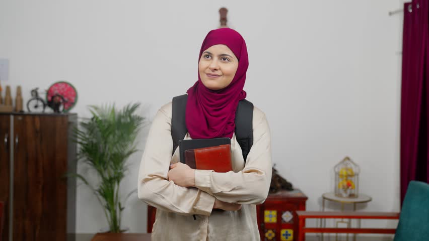 Muslim Woman Student in Hijab Scarf Looking Around - Powered by Shutterstock - Get 15% off with code: PIKWIZARD15