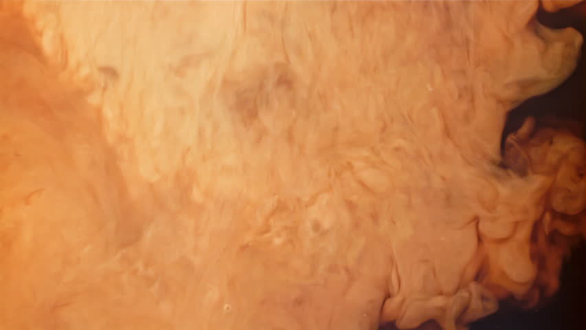 Milk is mixed with black coffee. Filmed on a high-speed camera at 1000 fps. High quality FullHD footage