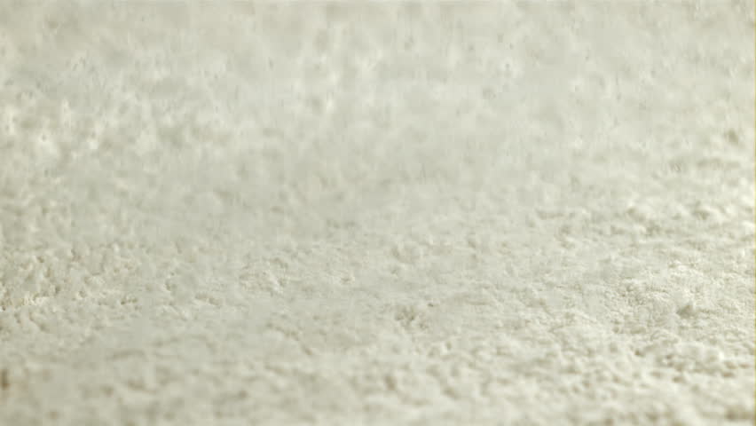 Flour falls on the kitchen table. Filmed on a high-speed camera at 1000 fps. High quality FullHD footage