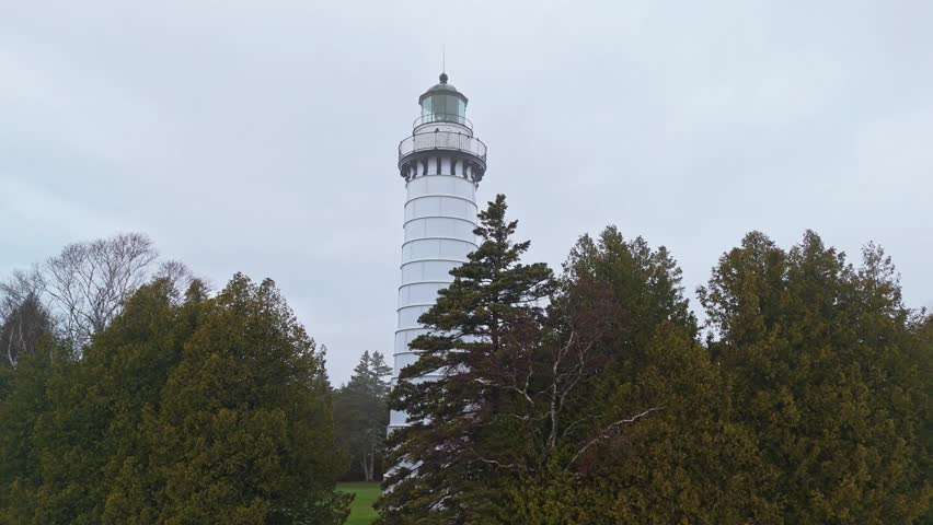 Dramatic aerial footage of Cana Island Lighthouse in Wisconsin, captured on a foggy day along Lake Michigan’s shoreline