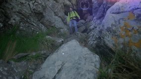 Male hiker descending rocky mountain pass, under digital navigation overlay for outdoor technology. Adventure, exploration, rugged, terrain, technology, resilience, outdoors - Powered by Shutterstock - Get 15% off with code: PIKWIZARD15