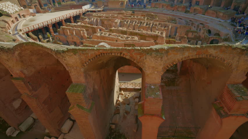Ruins of Roman Coliseum from the sand. View of the colosseum from the inside. Rome, Italy