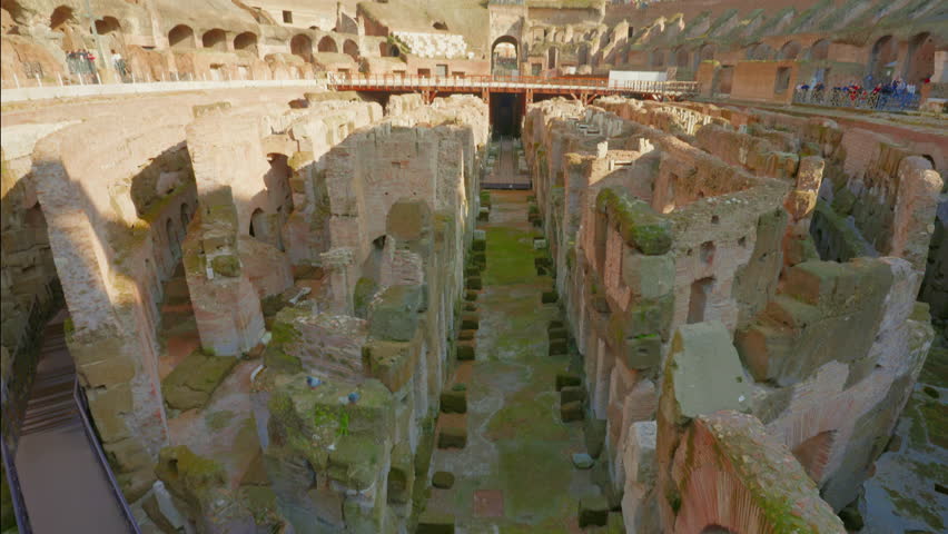 Ruins of Roman Coliseum from the sand. View of the colosseum from the inside. Rome, Italy