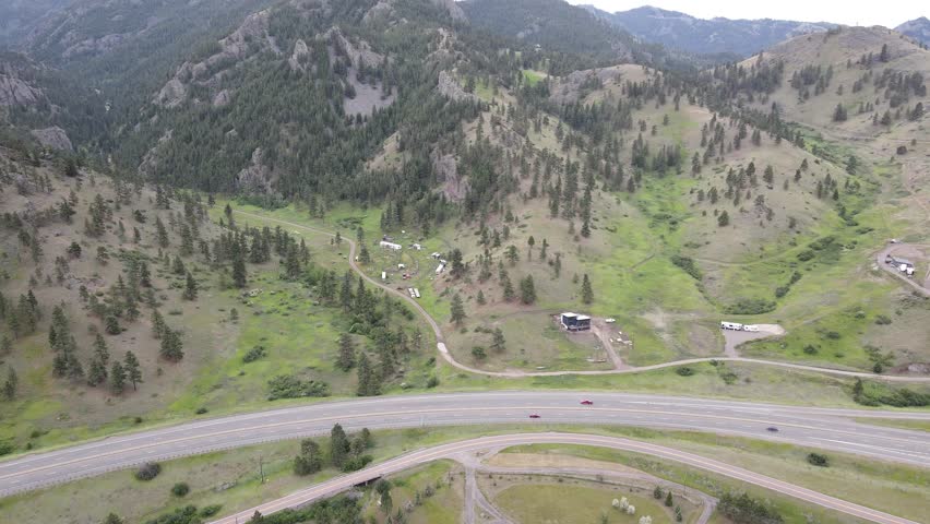 Drone Aerial camera flying along Montana in the Summer, Country Road, Wilderness
