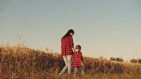 child girl daughter kid holding hand farmer mother, agriculture, business wheat field, healthy mother, cheerful child, enjoys nature outdoors, walking park, mother plays field ripening wheat, happy - Powered by Shutterstock - Get 15% off with code: PIKWIZARD15