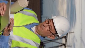 electrical engineer working digital tablet sunset, man helmet, power system analysis, high-voltage power lines, power system maintenance, power line inspection, electricity network control, technology - Powered by Shutterstock - Get 15% off with code: PIKWIZARD15