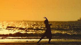 Woman dancing on the beach at sunset - Powered by Shutterstock - Get 15% off with code: PIKWIZARD15