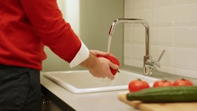 Man washing vegetables for salad - Powered by Shutterstock - Get 15% off with code: PIKWIZARD15