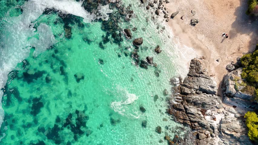 Aerial View of Playa Las Cujas with Turquoise Waters and Coastal Homes in Cachagua, Chile