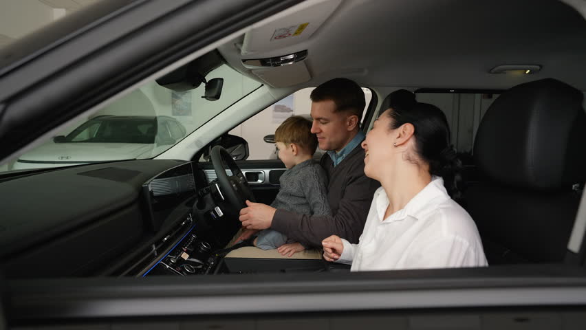 Happy family buying right-hand drive car with discount