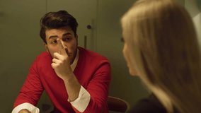 A couple discussing at a table. - Powered by Shutterstock - Get 15% off with code: PIKWIZARD15