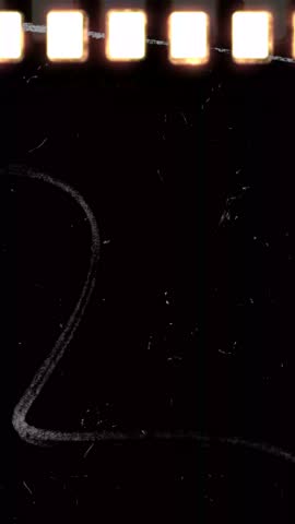 Vertical Authentic Dust and Grain Overlay Inspired by Damaged 8mm Footage. High quality 4k footage