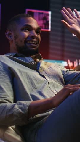 Vertical Video Young adult attending an online class via video conference on internet, meeting with a teacher for important virtual lesson. Black guy studying hard for his master degree remotely