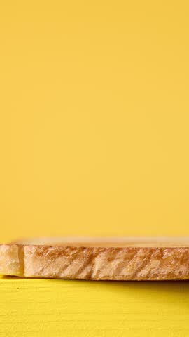 stop motion animation video of making club sandwich on bright yellow background