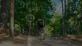 Mature male hiker trekking through pine forest trail, showing augmented reality technology graphics. Adventure, exploration, nature, outdoor, digital, innovation, wilderness - Powered by Shutterstock - Get 15% off with code: PIKWIZARD15