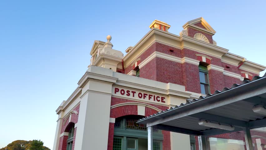 A series of frames showing the historic Queenscliff Post Office against a clear evening sky, highlighting architectural details