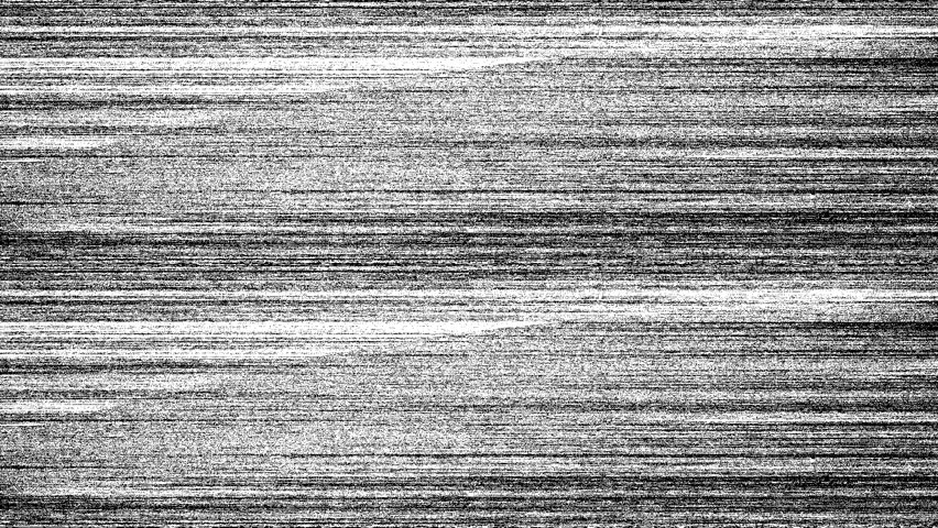 The video features a colored static glitch style TV noise background. It’s a chaotic digital texture composed of pixels primarily vibrant randomly distributed across the frame