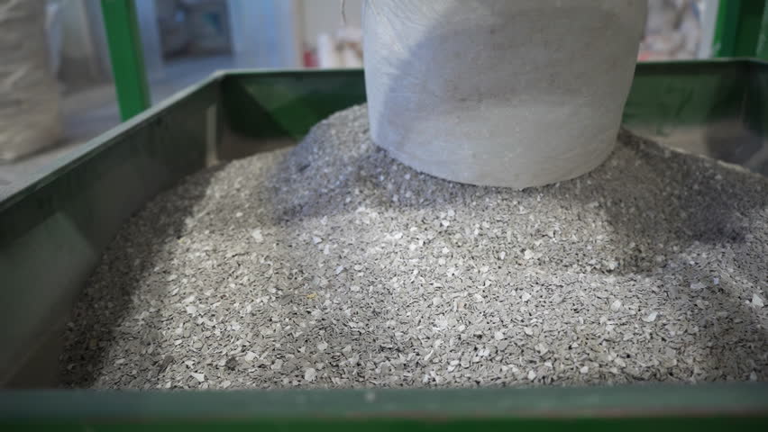 Recycling of waste material with modern equipment in manufacturing workshop. Effective goods production with reusable supplies at industrial complex