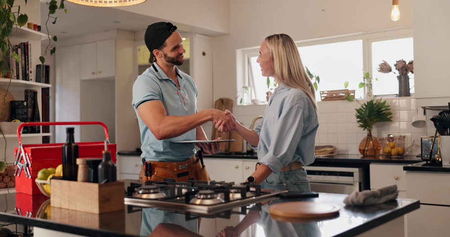 Man, plumber and handshake with customer in kitchen for leak, water service or repair at home. Male person, woman and shaking hands with client or thank you for house fix, agreement or call out