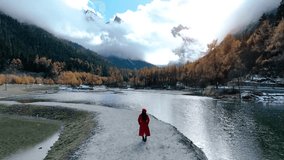Tourist taking a photo at Bipenggou national park in autumn, Chengdu in China. - Powered by Shutterstock - Get 15% off with code: PIKWIZARD15