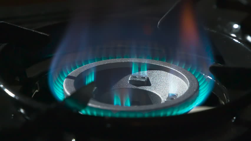 Blue Fire from the Gas Stove. The chamber slowly revolves around a gas burner with blue flames bursting out intensely