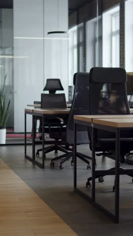 Modern business, glass-walled startup office, open and spacious workspace exudes a modern and innovative vibe, fostering a dynamic atmosphere that supports creativity, collaboration, and business