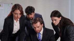 A group of professionals in formal attire celebrating a successful milestone in a modern office setting. Slow motion - Powered by Shutterstock - Get 15% off with code: PIKWIZARD15