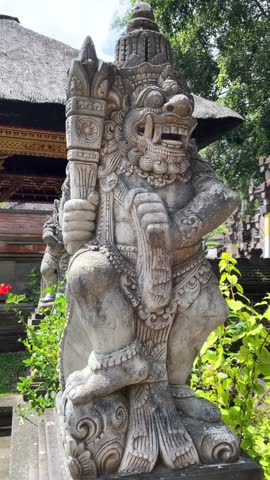 Balinese stone Barong statue in temple courtyard in Ubud, Bali, Indonesia